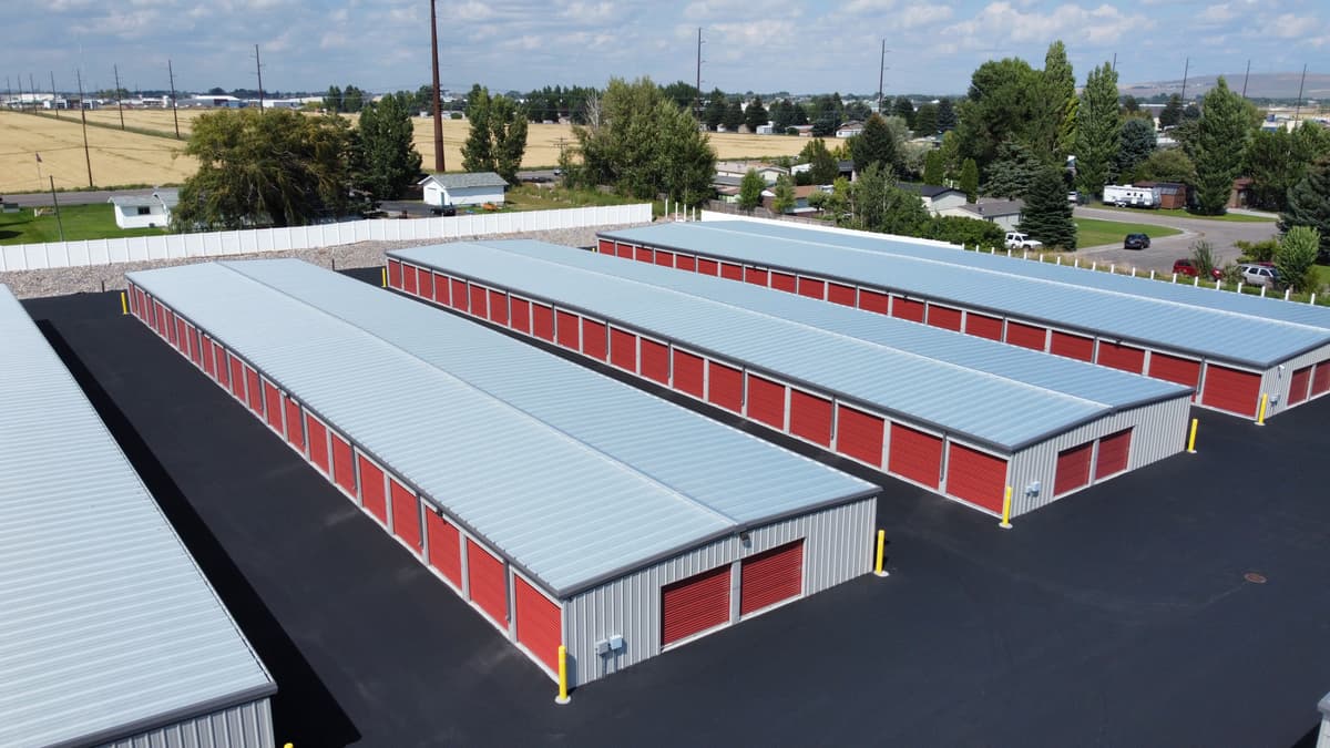 Aerial drone view of freshly seal coated storage facility parking lot by JC Property Maintenance in Utah