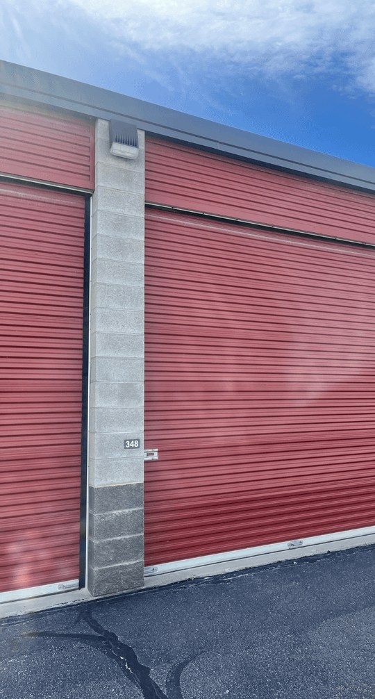 Metal roll-up door repair and replacement at a commercial storage facility by JC Property Maintenance